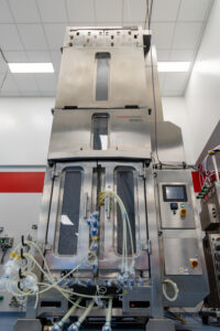 The Bioprocess Design Center floor in Plainville, Massachusetts, where workflow stages are co-located under zone markers including upstream small scale, harvest, large-scale downstream, analytics and cell therapy. This is the proximity Ram credits with helping scientists design processes with manufacturing in mind. (Credit: Thermo Fisher Scientific)